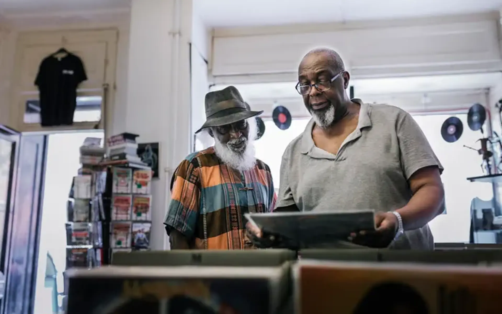 Two people browsing records