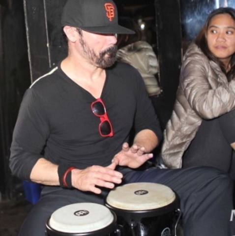 mike playing bongos