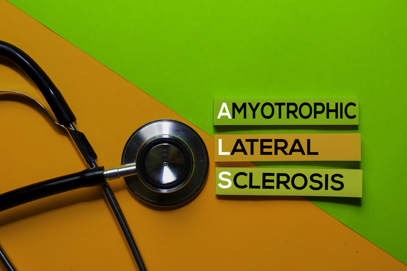 ALS, amyotrophic lateral sclerosis acronym on sticky notes.